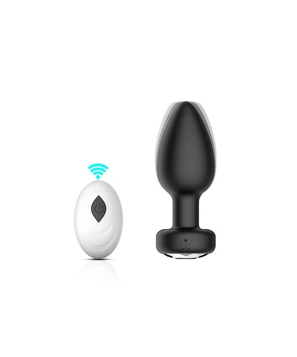 M vibrador sem fio preto e branco com controle remoto correspondente.