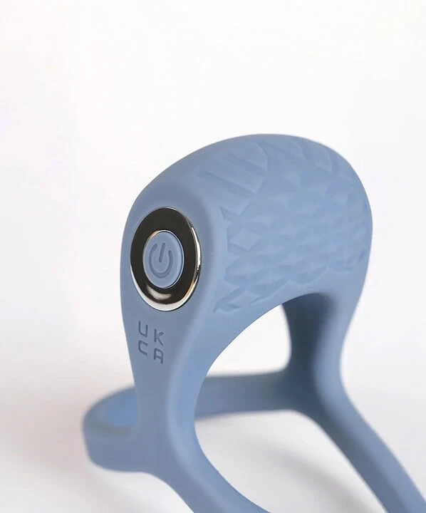 Anel vibratório azul com controle de energia e design ergonômico.