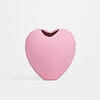Vibrador em formato de coração rosa para estímulo íntimo.