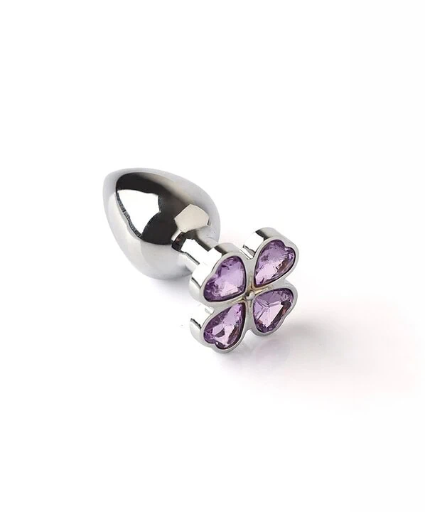 Piercing de metal com flor de ametista para uso íntimo.